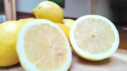 Video of fresh lemons on a wooden table