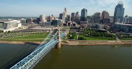 Cincinnati Ohio skyline towering above the Ohio river in stunning aerial view