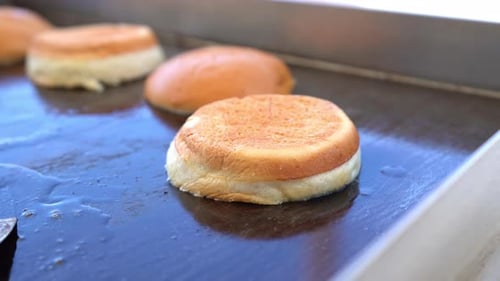 heating the bread on the grill