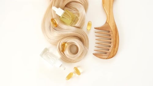 Blonde Hair with Oil and a Wooden Comb