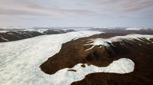 A Majestic Snowcovered Mountain Range Seen From Above