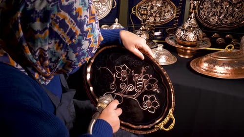 Close-up Footage of Woman Decorating Copper