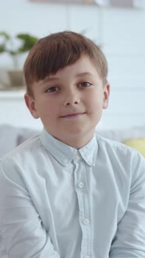 Portrait of a Smiling Young Boy Indoors
