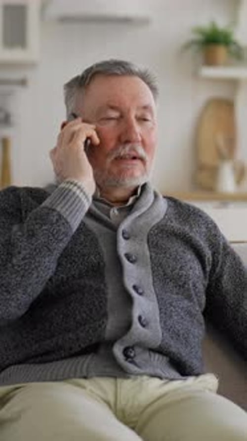 Senior Man Smiling and Talking on Smartphone
