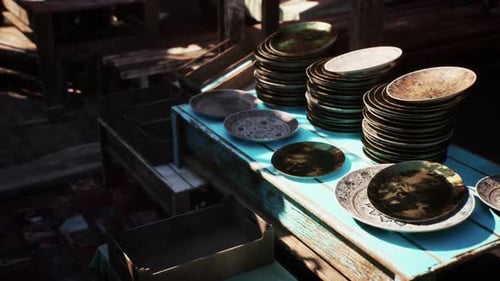 Rustic Display of Decorative Antiqued Plates in Market Stall