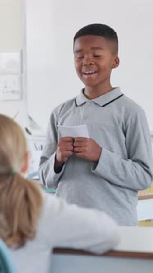 Boy, school and talking for oral presentation, show and tell with learning