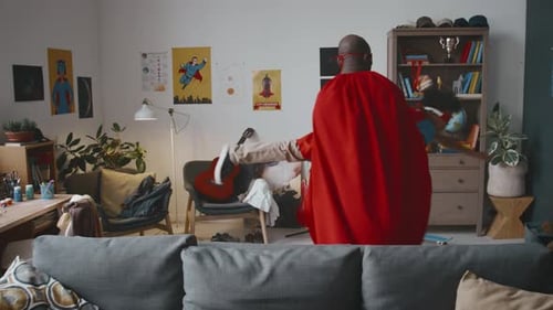 Father and Child Play Superhero in Living Room