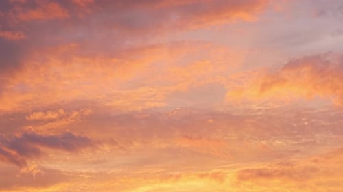 Vibrant Clouds Drifting in the Sunrise Sky