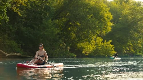 SUP Touring And Traveling By Paddle Boards In River In Summertime Enjoy Beauty
