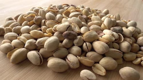 Food background. Roasted pistachio nuts seed with shell close up. Dieting concept