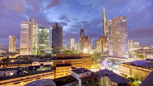 Beautiful night time-lapse of Frankfurt skyline, german cityscape, clouds moving