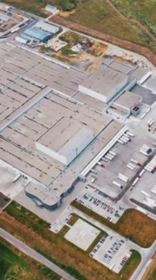 Modern Factory Exterior. Aerial footage of a large industrial complex. Vertical video