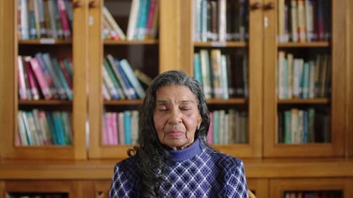Senior portrait, law professor and teacher in library at university, expert in philosophy