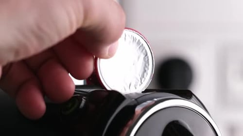 Coffee Pod Inserted Into Espresso Machine Close-up