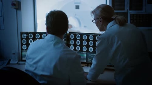 Doctors Analyzing MRI Scans in Hospital Setting