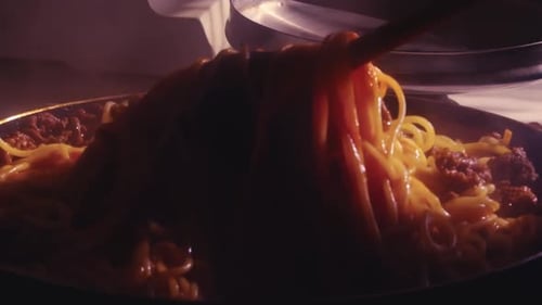 Steaming Spaghetti Meat Sauce Being Stirred in Pan