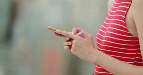 Closeup of woman hands holding smartphone