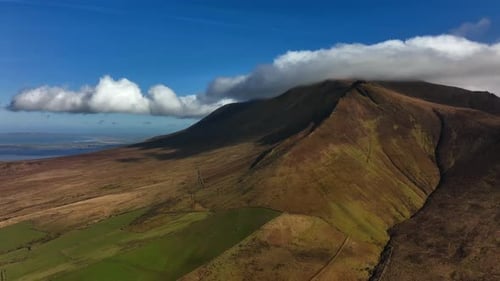 Slieve Mish Mountains, Kerry, Ireland, March 2022. Drone descends while pulling south from the