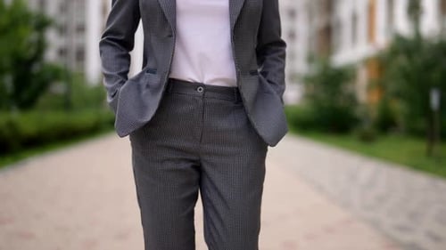 Slender Woman is Walking Alone in City in Summer or Spring Day Closeup View on Body Waist and Hips