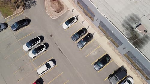 Top View Tesla Electric Cars are Charged in a Parking Lot in Dartmouth Canada