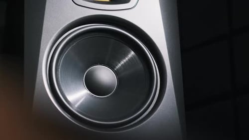 Studio Bass Speaker Vibrates From Loud Music in a Recording Studio CloseUp