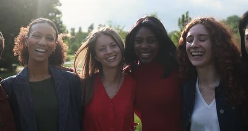 Diverse Group of Young Women Embracing and Smiling