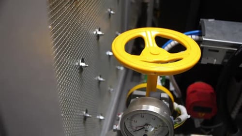 Yellow Lever and Pressure Meter with Pipes in Plant Workshop