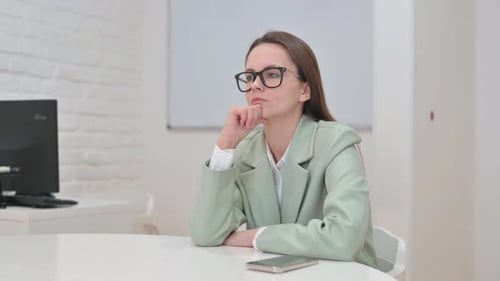 Pensive Business Woman Brainstorming for Project