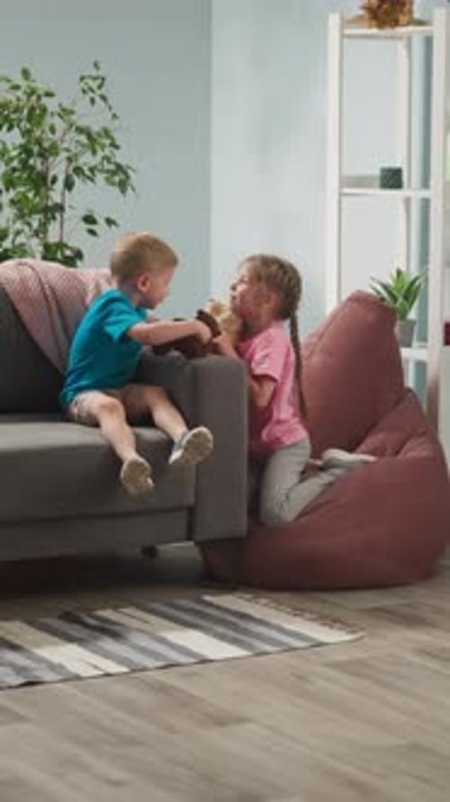 Adorable Children Playing With Teddy Bears and Kissing