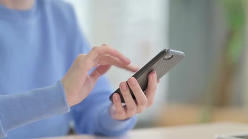 Close up of Woman Browsing Internet on Smartphone