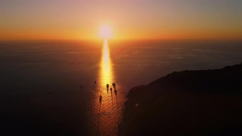 Tranquil Aerial Landscape of Island in Front of the Sea and Amazing Sunset Shining in the Skyline