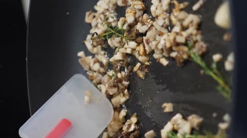 Chef Frying Cutted Mushrooms on Frying Pan Stirring Pan with Spatula Slow Motion Vertical Footage