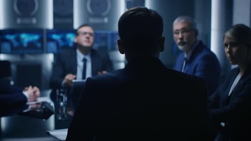 People in Suits Having Discussion in Modern Room