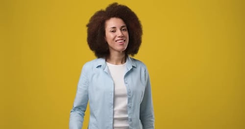 Young Friendly Smiling African American Woman Gesture Waving Arm Showing Goodbye Bye Gesture