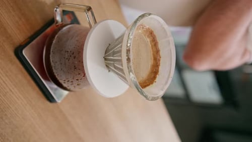 Pour Over Coffee Brewing into Glass Carafe