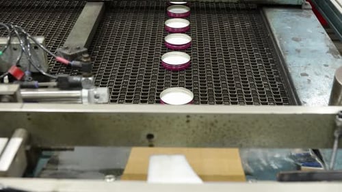Bottle Caps Moving On Lining Conveyor Belt