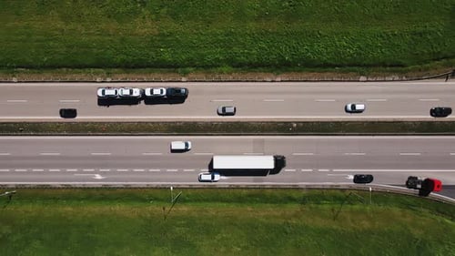 Aerial View of Highway Traffic with Cars and Trucks in Motion