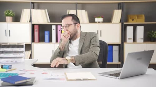 Man Working in Office Coughing Repeatedly