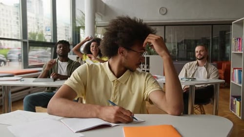 Students Throwing Paper Balls in Library Classroom