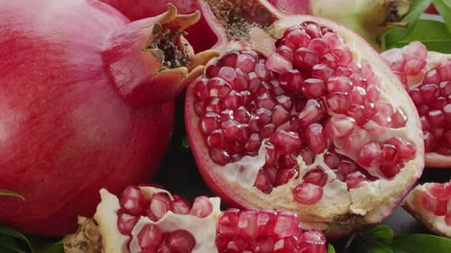 Ripe Pomegranates Displaying Juicy Red Seeds