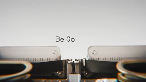 Old mechanical typewriter typing Be Consistent in a close-up view.