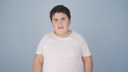 Boy winking at camera.