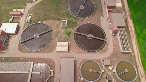 Aerial Drone View of Modern Water Treatment Plant in Green Valley, Clean Environment Concept