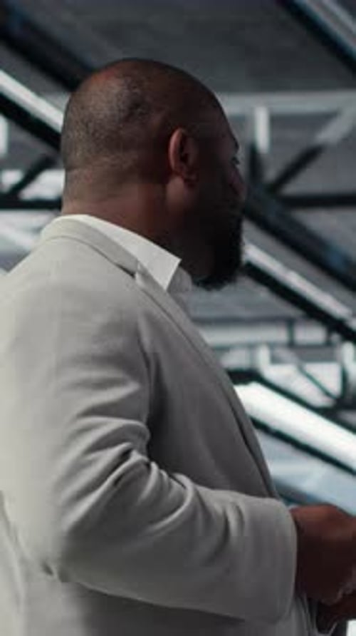 Vertical Video Admin Walking in Data Center Industrial Platform Analyzing Performance