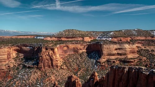 Time Lapse, Colorado National Monument USA, Light Clouds Above Red Sandstone Cliffs and Canyon