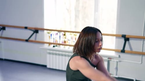 Woman Dancing in a Bright Studio