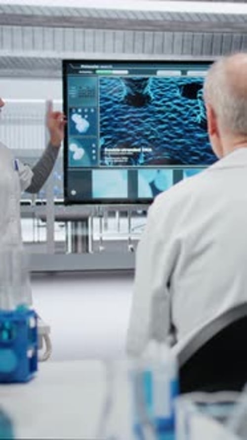 Vertical Video Woman Presenting Innovative Drug Development Findings to Team in Laboratory