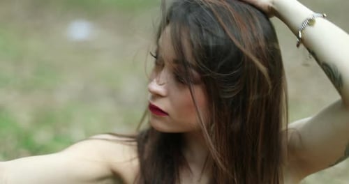 Attractive Woman Takes Selfie with Phone Outdoors