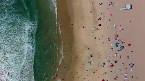 over head looking down shot with a drone of beach goers in manhattan