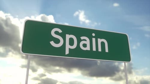 Welcome to Spain road sign on blue sky with clouds